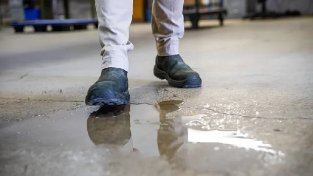 Man about to slip in puddle Man about to slip in puddle