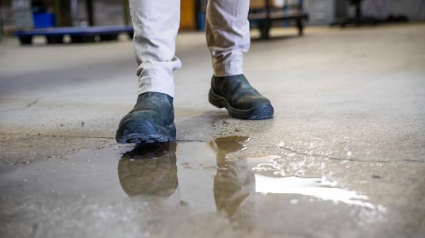Man about to slip in puddle