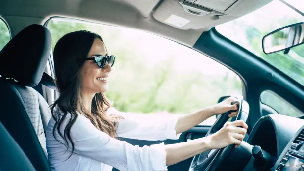A lady driving a car