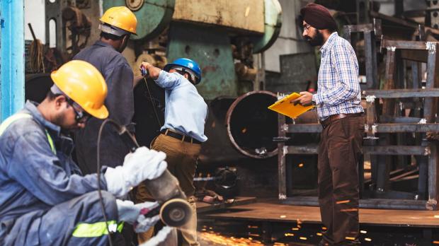 worman working with metal